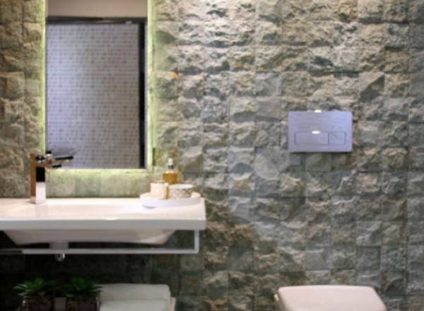 projeto de banheiro revestido com pedra hijau bruta artemano revestimentos naturais