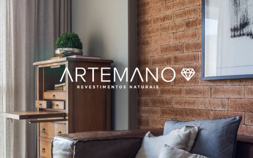 Sala de estar com estilo rústico e parede revestida por tijolo inglês Artemano.